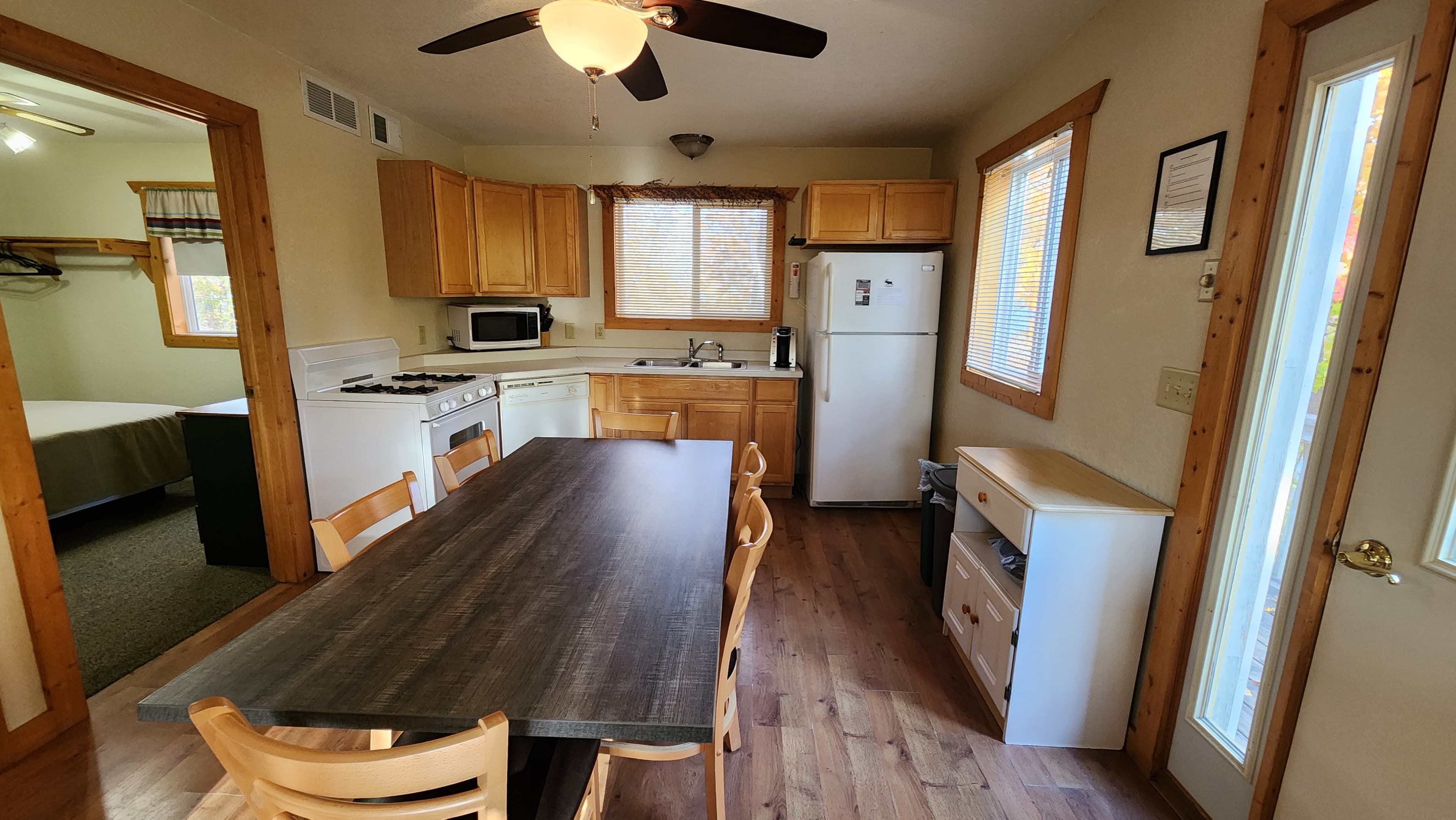 Fully stocked kitchen that includes a dishwasher.