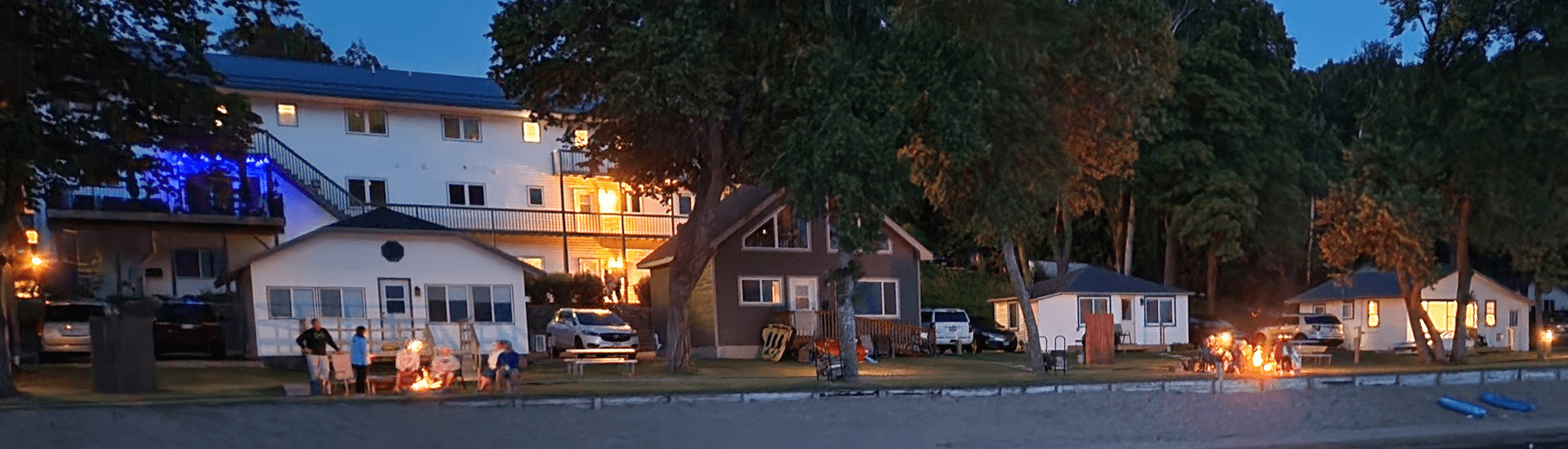 Shoreline of viking bay lodge, cabins, with sun setting at dusk